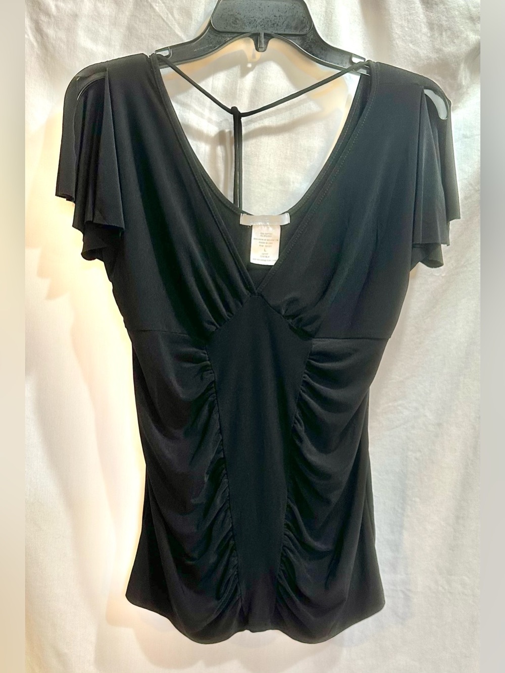 Black Ruched V-Neck Flutter Sleeve Top with a back tie.